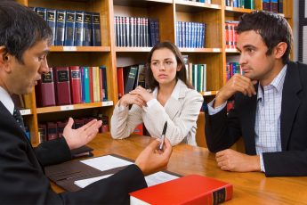 Lawyer Discussing with Couple for Divorce